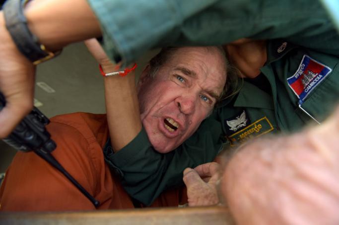 Australian filmmaker James Ricketson reacts as he attempts to speak to journalists from a prison vehicle after his verdict at the Phnom Penh court on August 31, 2018. Photo: Tang Chhin Sothy/AFP
