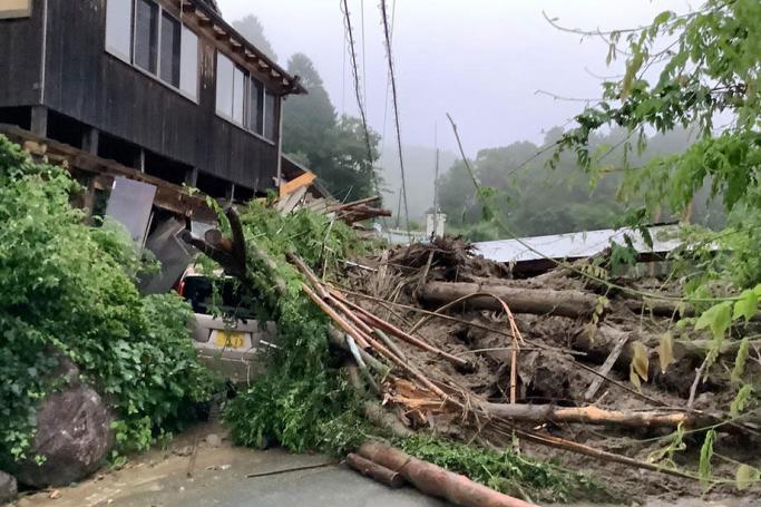 A handout photo made available by Saga Prefecture shows a vehicle destroyed on a landslide triggered by heavy rain in Kanzaki(issued 15 August 2021). Photo: EPA