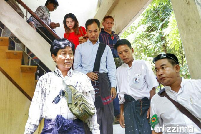 Myanmar Now Editor in Chief Swe Win (centre, behind) leaving the court hearing. Photo: Mizzima
