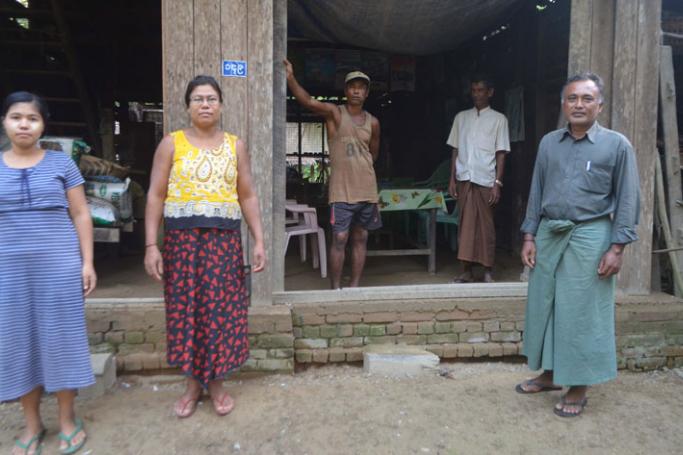 A family of Kamans including Than Win, the MP candidate running for a seat in the Rakhine State parliament seen in front of their home in Thandwe. Photo: Swe Win/Myanmar Now

