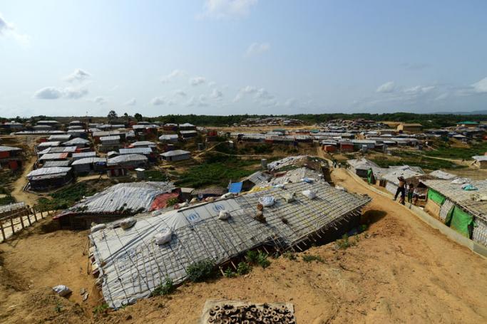 In this photograph taken on May 7, 2018, sand bags are seen on the roof of a shelter to weigh it down in preparation for the upcoming monsoon season in Kutupalong refugee camp in Ukhia. Photo: Munir Uz Zaman/AFP
