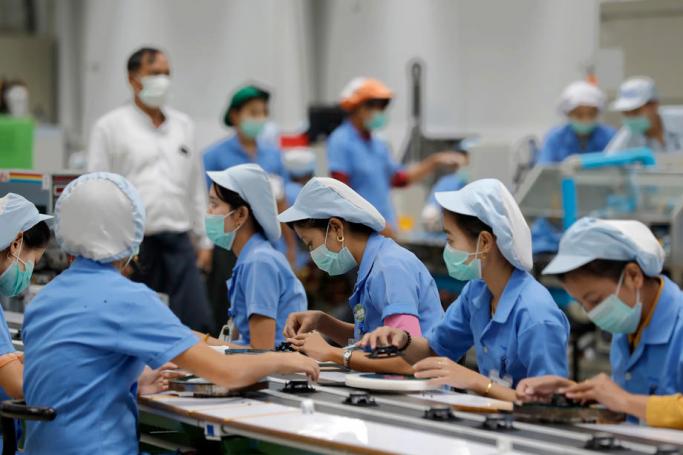 Workers assemble parts at Foster Electric Thilawa Co., Ltd. in the Thilawa Special Economic Zone (SEZ) on the outskirt of Yangon, Myanmar, 21 August 2019. Photo: Nyein Chan Naing/EPA
