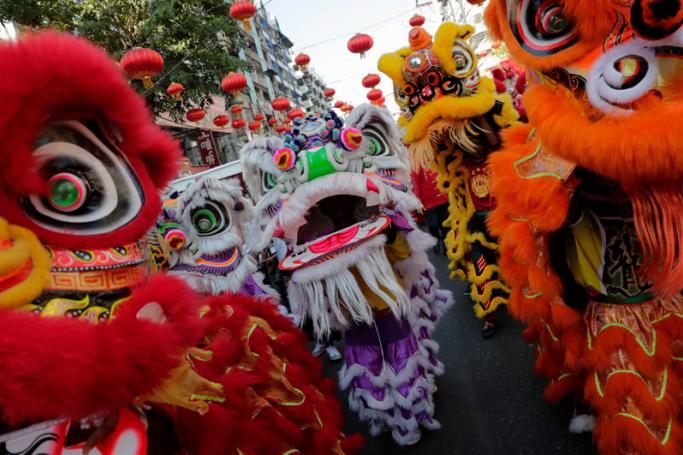 A lion dancers march during Chinese Lunar New Year or Spring Festival celebration at Chinatown in Yangon, Myanmar, 05 February 2019. Photo: Lynn Bo Bo/EPA