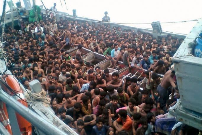 Migrants who were seized by the Myanmar navy in a boat off Myanmar's southern coast, 29 May 2015. Photo: EPA
