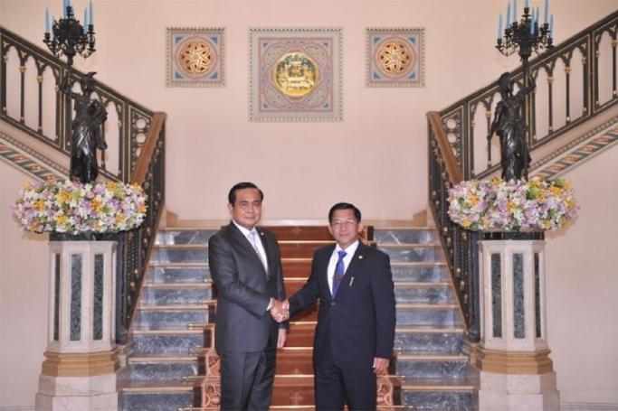Myanmar Defence Forces Commander-in-Chief Senior General Min Aung Hlaing greeted by Thai Prime Minister Prayut Chan-o-cha during a meeting at Government House in Bangkok, Thailand, 27 August 2015. Photo: Thai government
