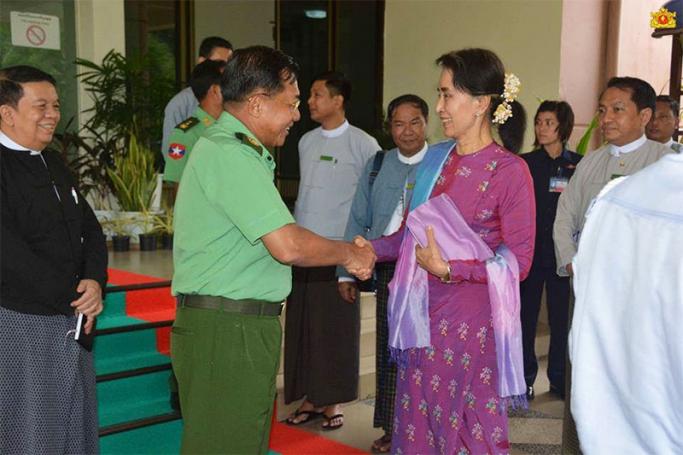 Senior General Min Aung Hlaing, left, shakes hands with State Counsellor Daw Aung San Suu Kyi at the State Counsellor Office in Nay Pyi Taw on 8 August 2016. Photo: Myanmar State Counsellor Office
