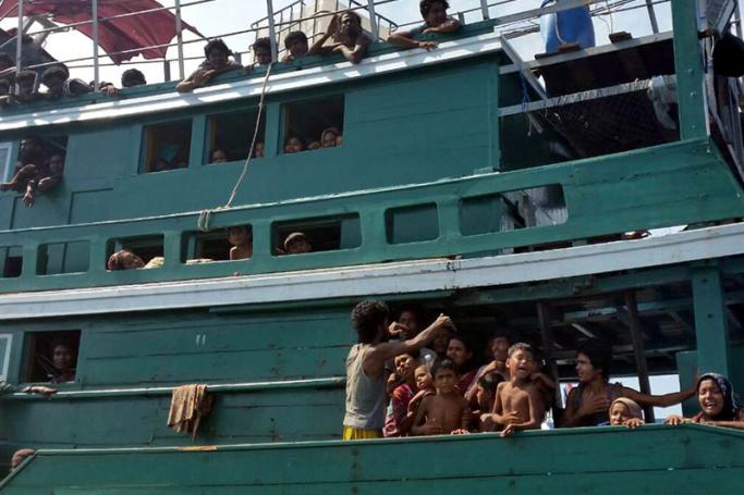 Ethnic Muslim Rohingya migrants, believed to have come from Myanmar and Bangladesh, on an abandoned boat drifting in the Andaman Sea close to Malaysia, southern Thailand, 14 May 2015. Photo: EPA
