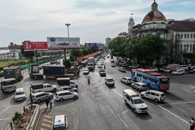 Motorists travel along a road in Yangon. Photo: AFP