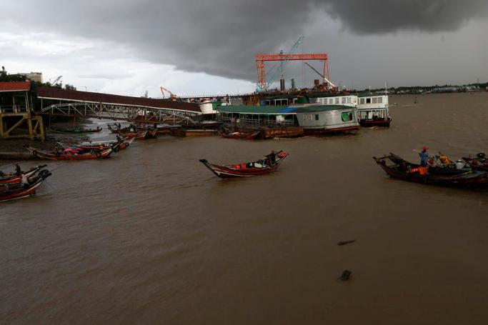 Ferry boats transport passengers across Yangon river under the rain clouds in Yangon, Myanmar, 28 July 2020.  Photo: Lynn Bo Bo/EPA