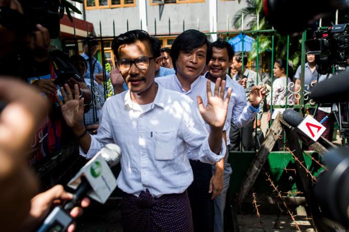 This file photo taken on October 26, 2018 shows detained Myanmar journalists Kyaw Zaw Lin (L) followed by Nayi Min (C) and Phyo Wai Win (R) leaving the court compound after a hearing in Yangon. Ye Aung Thu/AFP
