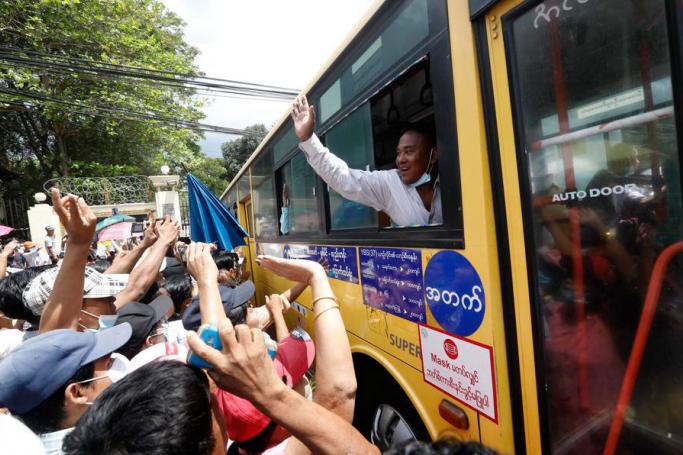Released prisoners from the bus greet with their relatives and friends after being granted amnesty, outside the Insein Prison in Yangon, Myanmar, 17 April 2021. Photo: EPA