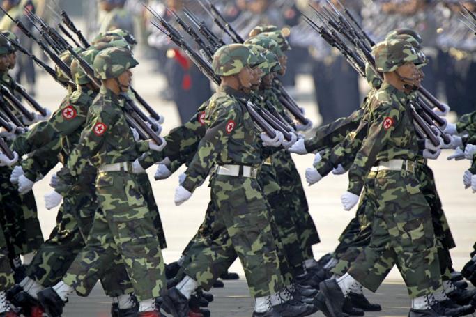 Myanmar military soldiers march during the 69th Armed Forces Day in Naypyitaw, Myanmar, 27 March 2014. Photo: Lynn Bo Bo/EPA
