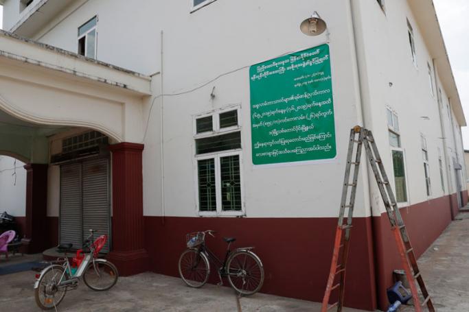 A shutdown temporary prayer place with the poster on its wall showing the permission document of Yangon Regional Government after mobs forced local authorities to close, Yangon, Myanmar, 16 May 2019. Photo: Lynn Bo Bo/EPA