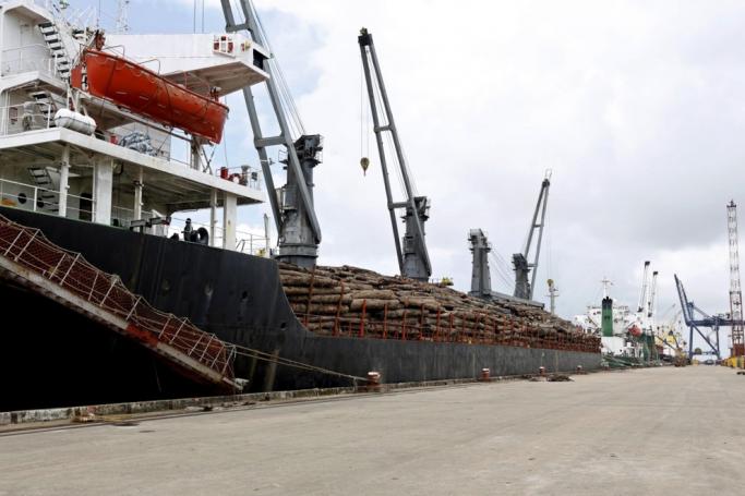 (File) A ship loaded with teak wood logs at the Thilawa port, Yangon, Myanmar. Photo: EPA