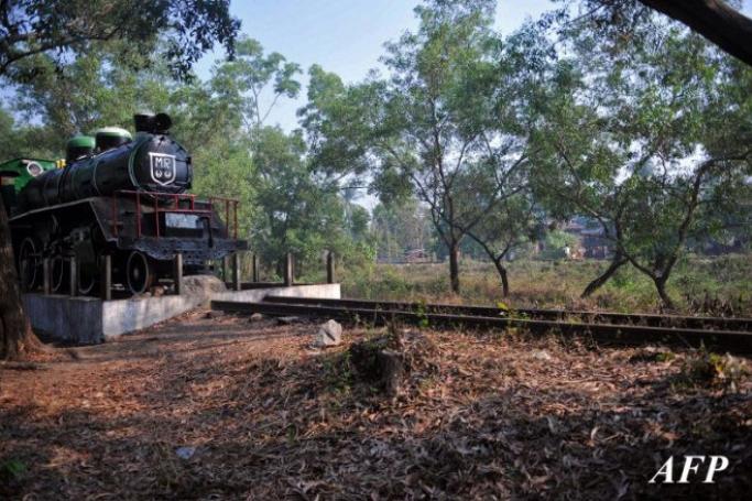 A locomotive sitting on the last remaining portion of the "Death Railway" at Thanbyuzayat in Myanmar's eastern Mon state. Weeds have swallowed much of the old railway track and a modest cemetery is a lonely testament to the thousands of prisoners of war and Asian workers forced to build the railway. But the local authorities plan to reinvigorate the railway site with the aim to transform the area. Photo: Ye Aung Thu/AFP
