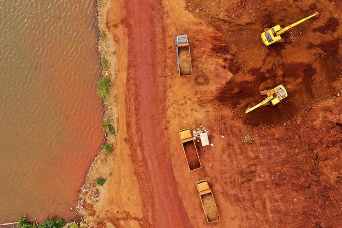 This aerial picture taken on February 11, 2023 shows excavators and trucks involved in a nickel mining operation in Pomalaa in southeast Sulawesi. Photo: AFP