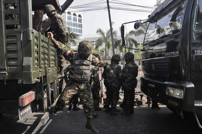 (File) A soldier jumps down from a vehicle during a protest outside the Central Bank in Yangon, Myanmar, 15 February 2021. Photo: EPA