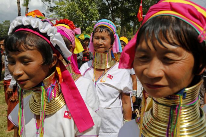 Padaung ethnic women arrive to listen to a speech byMyanmar opposition leader Aung San Suu Kyi during her first official election campaign at Demoso township Kayah State, eastern Myanmar, 10 September 2015. Photo: Lynn Bo Bo/EPA
