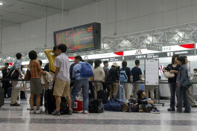 Passengers are stranded at Chitose Airport in Chitose city, Hokkaido. Photo: EPA