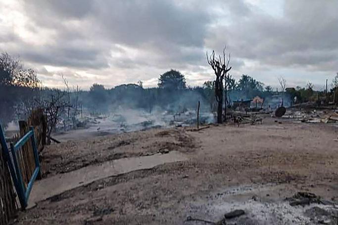 This handout from Pauk Township News taken and shows the remains of houses after they were burnt in Kin Ma village in Pauk Township, Magway region. Photo: AFP
