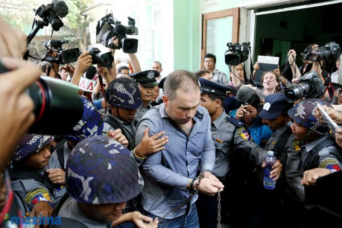 Philip Blackwood (C) comes out of court after being sentenced to two and a half years in jail, Yangon on March 17, 2015. Photo: Thet Ko/Mizzima
