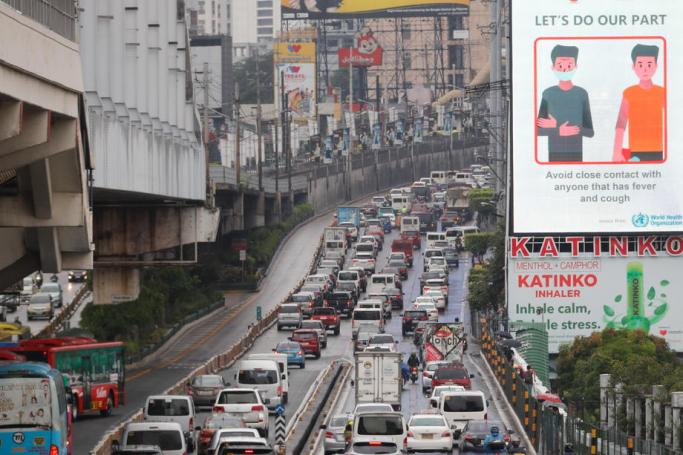 Traffic builds up along a road during a downpour in Makati south of Manila, Philippines. Photo: EPA