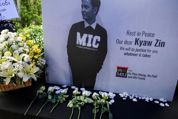 A poster bearing the portrait of Kyaw Zin Win is displayed by supporters of Myanmar's LGBT community during a rally outside Myanmar Imperial University in Yangon on June 28, 2019 where the victim used to work as a librarian. Photo: Ye Aung Thu/AFP
