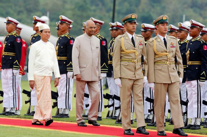 Indian President Ram Nath Kovind (C, front) and Myanmar's President Win Myint (L, front) review an honor guard during a welcome ceremony presidential house in Naypyitaw, Myanmar, 11 December 2018. Photo: Hein Htet/EPA