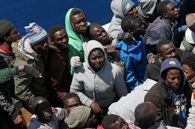 World Refugee Day 2015 - Over 200 illegal migrants rescued by the Italian Guardia di Finanza boat 'Denaro' in the Mediterranean Sea, 22 April 2015. Photo: Alessandro di Meo/EPA
