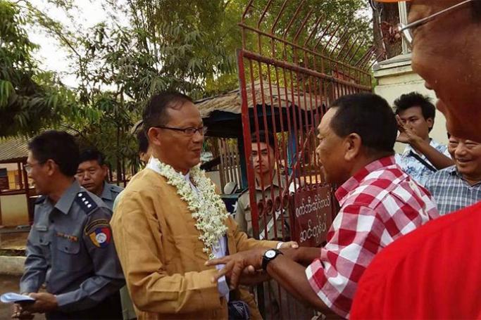 Released prisoner, U Htin Lin Oo is welcomed by his friend at Monywa prison on 17 April, 2016. Photo: AKL
