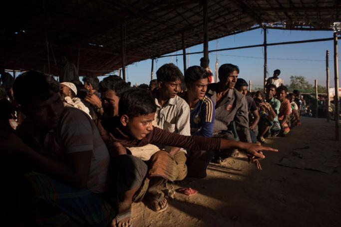 Rohingya Muslim refugees queue for relief suplies in the the Kutupalong refugee camp in Cox's Bazar on December 4, 2017. Photo: Ed Jones/AFP
