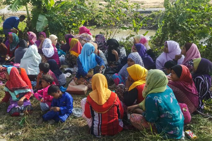 Rohingya refugees, who landed on an isolated northern shore near the Malaysia-Thai border, huddle in a group in Kangar on March 1, 2019, following their detention by Malaysian immigration authorities. Photo: Ismael Kamaldin/AFP