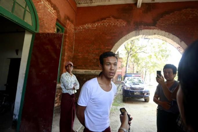 Student protester San Lin Htike (C) talks to media after his release from Tharyarwaddy district administrative office in Bago division, Myanmar, March 12, 2015. Photo" Nyein Chan Naing/EPA
