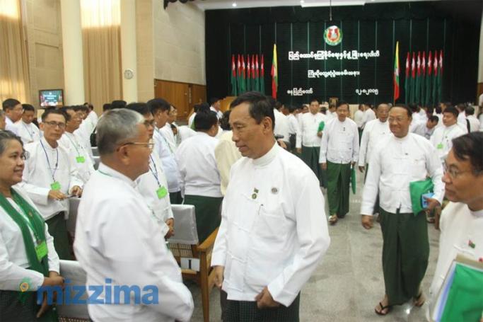 U Shwe Mann talks with a member of USDP during their Party meeting in Nay Pyi Taw on August 12, 2015. Photo: Min Min/Mizzima
