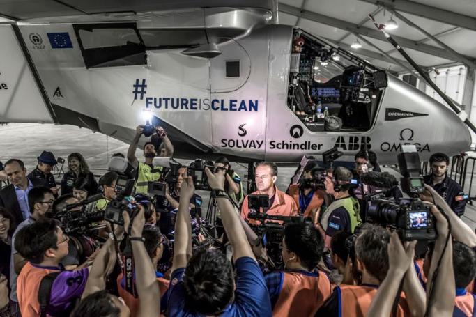Pilot Andre Boschberg (C) during interviews ahead of the take off of Solar Impulse 2 -a solar powered plane- in Nanjing China, 31 May 2015. Photo: EPA
