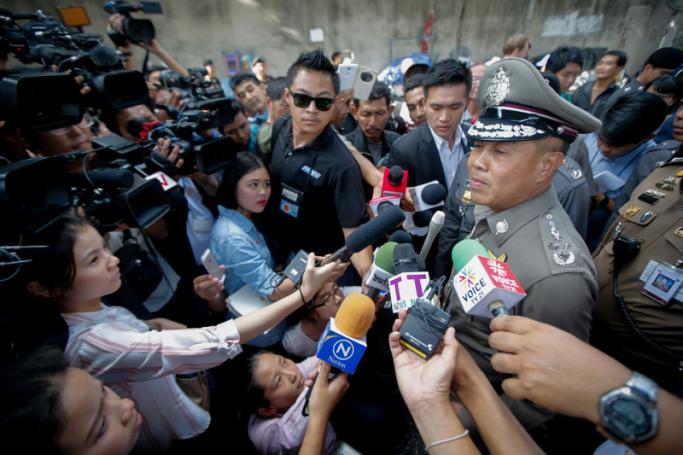 Thai Police Chief Gen. Somyot Poompanmoung (R) talks to journalists at Sathorn Pier, Bangkok, Thailand, 18 August 2015. Photo: Diego Azubel/EPA 
