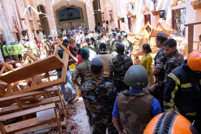 File) Police and locals inpect the damage and fataliaties in Katuwapitiya St. Sebastian church in Negombo near Colombo, Sri Lanka, 21 April 2019. Photo: EPA