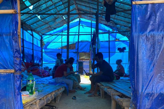 Refugees from Myanmar rest in a basic shelter at Farkawn quarantine camp in India's eastern state of Mizoram near the Myanmar border on Thursday, after they fled across the border following attacks by Myanmar's military on villages. Photo: AFP