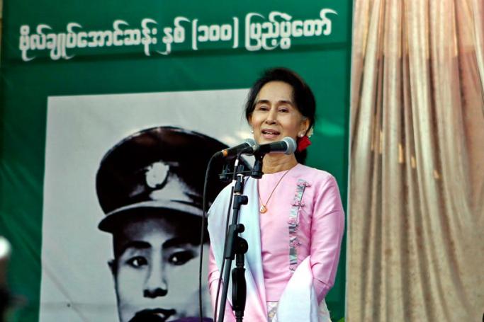 Daw Aung San Suu Kyi delivers a speech during the opening ceremony of the centennial anniversary of her father General Aung San in NatMauk township (birthplace of General Aung San), Magwe division, central Myanmar, 13 February 2015. Photo: Pyae Sone Aung/EPA
