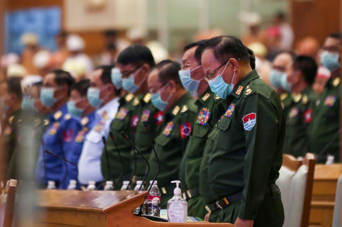 Members of parliament from the Myanmar Armed Forces wear protective face masks as they attend the Assembly of the Union (Pyidaungsu Hluttaw) at the Parliament building in Naypyitaw, Myanmar, 04 March 2020. Photo: EPA