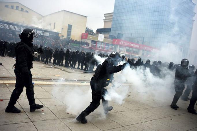 Myanmar - on a UK Foreign Office blacklist - may have been a recipient of UK-supplied riot control equipment, according to a UK newspaper report. Here Kosovo police officers fire tear gas during clashes at a demonstration in Pristina, Kosovo, January 27, 2015. Photo: EPA
