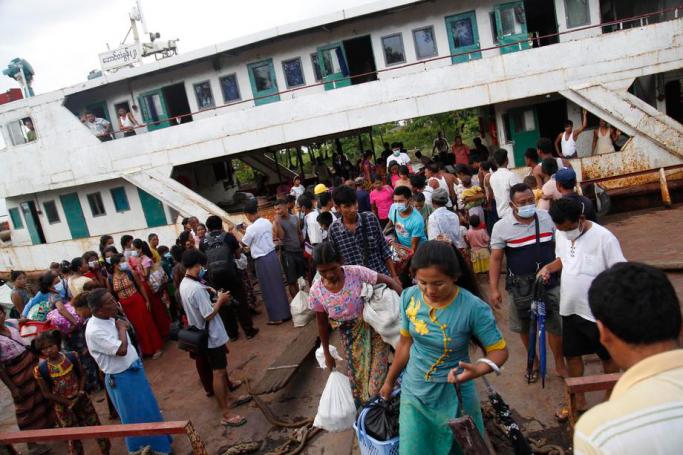 Rakhine people who fled Rathedaung township due to an ongoing conflict between the Myanmar military and the Arakan Army, arrive in Sittwe, Rakhine State, Myanmar, 27 June 2020. Photo: Nyunt Win/EPA