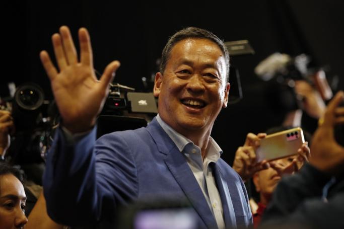 Pheu Thai Party's Prime Ministerial candidate Srettha Thavisin waves during an interview to members of the media after the polls closed in the general election in Bangkok, Thailand, 14 May 2023. Photo: EPA