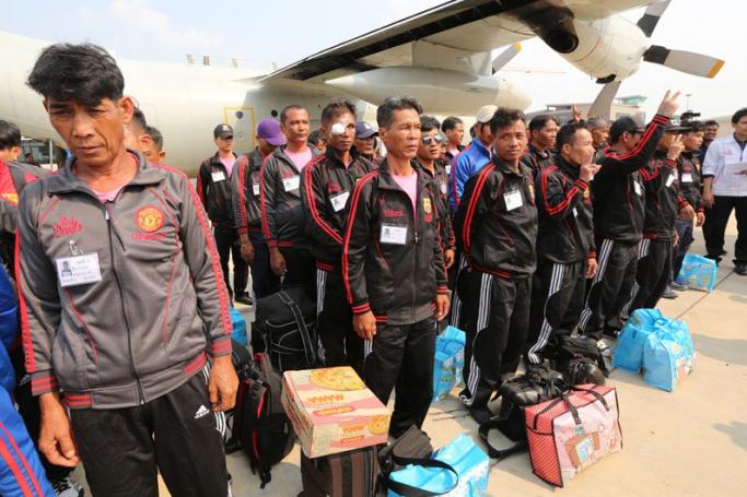Both Myanmar and Thai migrant workers have suffered at the hands of the poorly regulated fishing industry. Here Thai fishing industry workers alleged to have been working under slave labour conditions arrive back in Thailand from Ambon island, Indonesia, at an Air Force airport in Bangkok, Thailand, April 9, 2015. Photo: Narong Sangnak/EPA 
