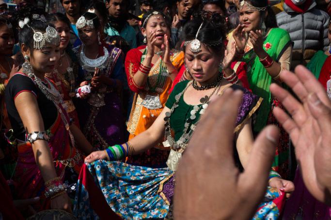 (File) Nepalese women of the Tharu community wear ethnic attire as they participate in a parade marking the Makar Sankranti festival in Kathmandu, Nepal, 15 January 2019. Photo: EPA