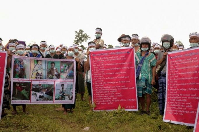 Karen ethnic people hold posters and shout slogans during a protest against Myanmar Army for the allegedly arbitrary killings, raping, shelling and for the removal of the army camps, at Hpapun in Kayin State on July 28, 2020. Photo: AFP