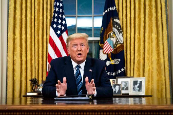 US President Donald J. Trump addresses the nation from the Oval Office about the widening coronavirus crisis, in Washington, DC, USA, 11 March 2020. Photo: EPA