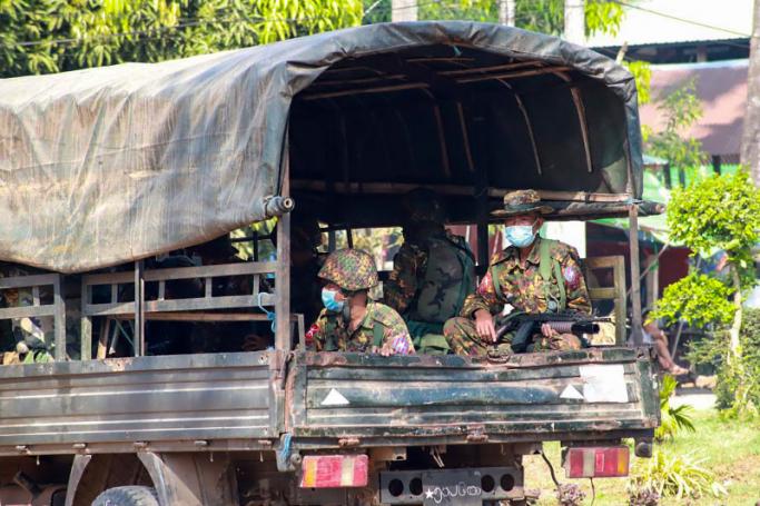 This handout from the Free Burma Rangers taken between April 5 and 6, 2021 and released on April 7, 2021 shows soldiers sitting in a truck in a village in Dooplaya district in Myanmar's eastern Karen state, as the country remains in turmoil after the February military coup. Photo: AFP