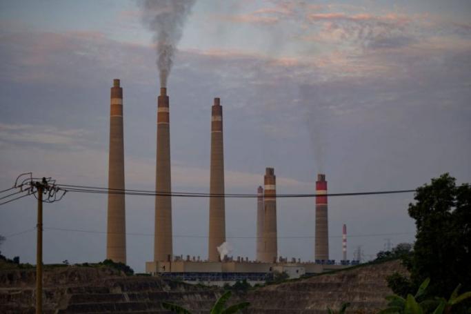 Smokestacks belch noxious fumes into the air from a massive coal-fired power plant on the Indonesian coast, a stark illustration of Asia's addiction to the fossil fuel which is threatening climate targets. PHOTO: AFP