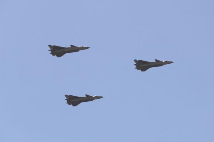 Chinese J-20 stealth fighter jets fly past during a military parade at the Zhurihe training base in China's northern Inner Mongolia region. Photo: AFP